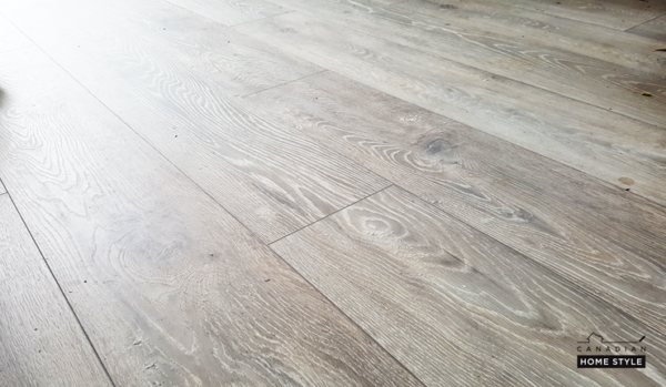 A close up of Torlys NatureTEK Waterproof Laminate Flooring in a room.