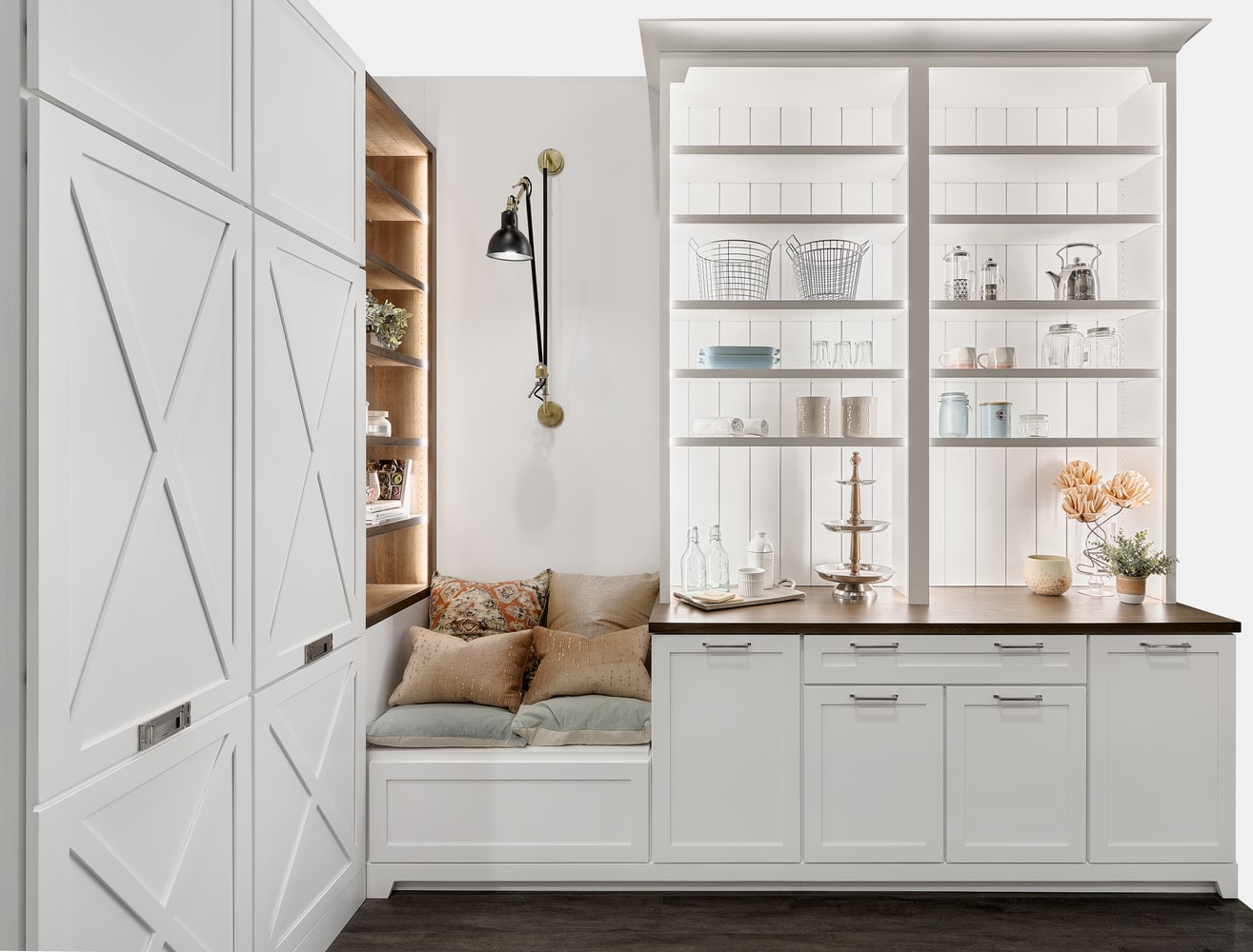 A white kitchen with shelves and a bench, undergoing a Vancouver kitchen renovation.