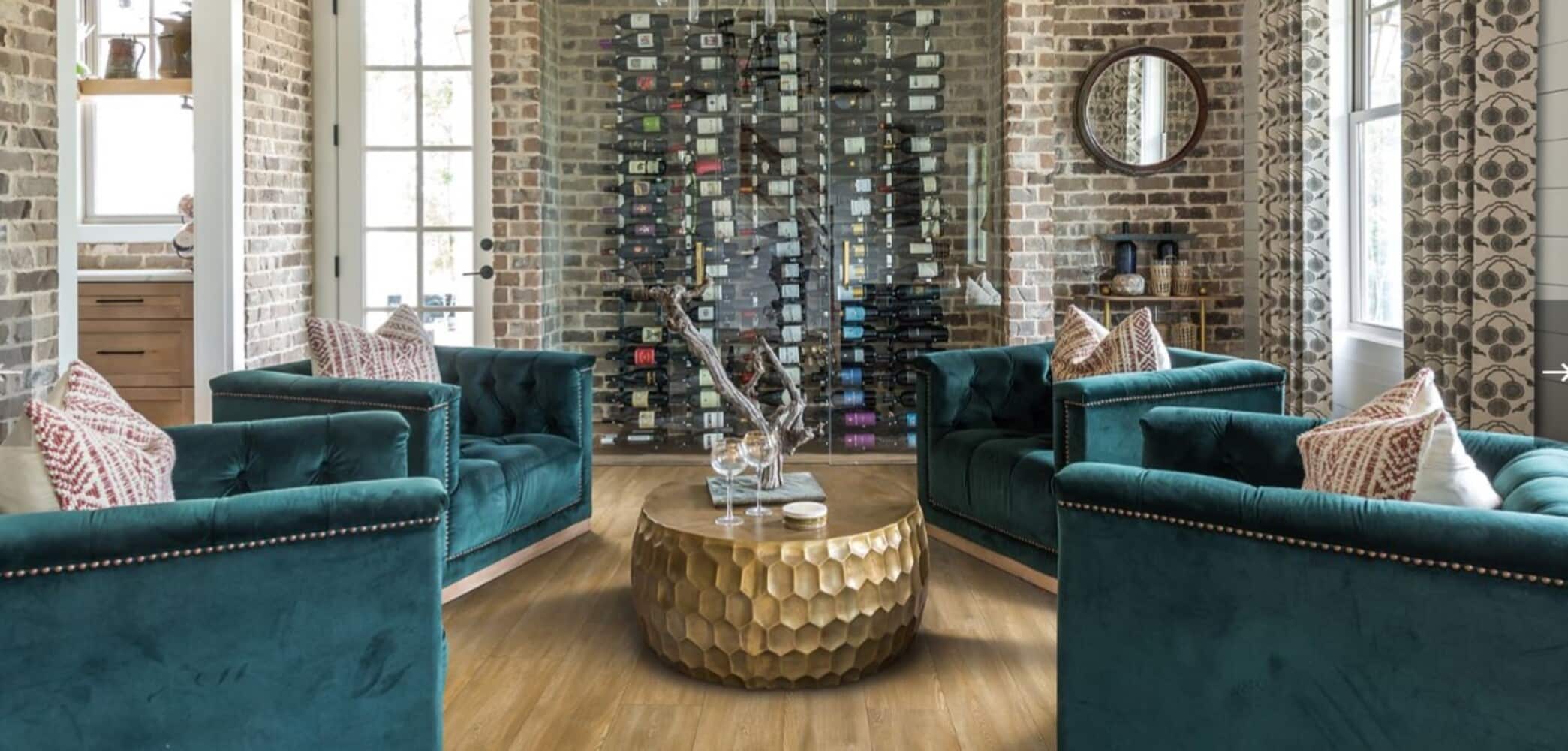 A living room with Mannington Adura green velvet chairs and a coffee table.