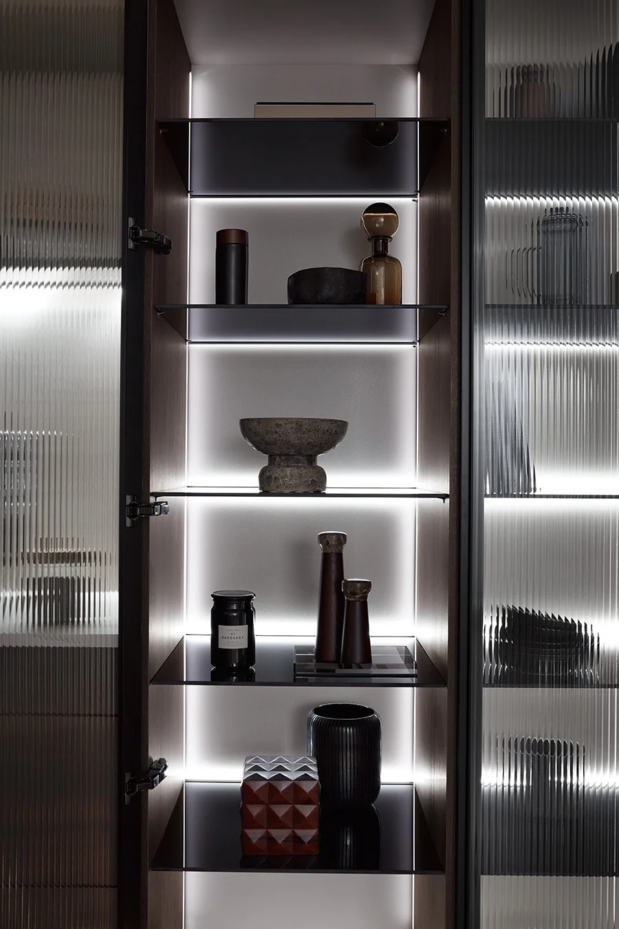 Handleless light kitchen cabinetry maximizing space in a Vancouver home