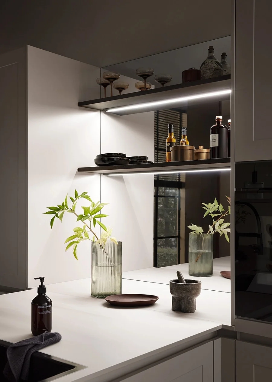 Muted mid-tone Bauformat kitchen cabinets in a Vancouver family home