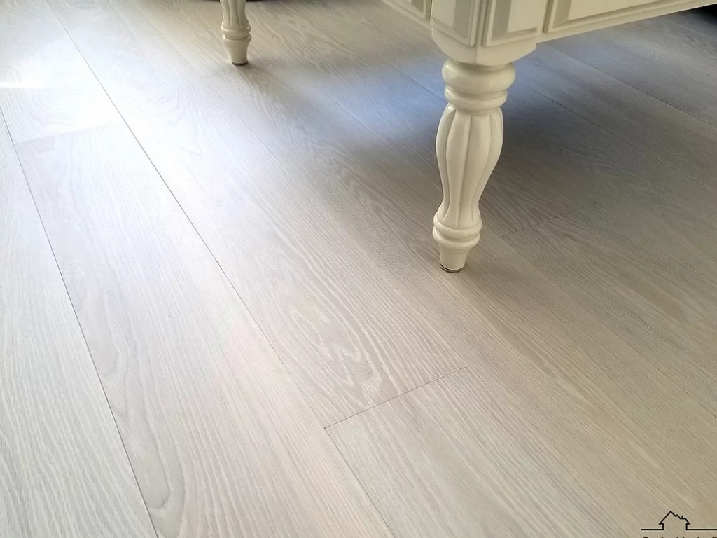 A white wooden floor in a Vancouver living room.