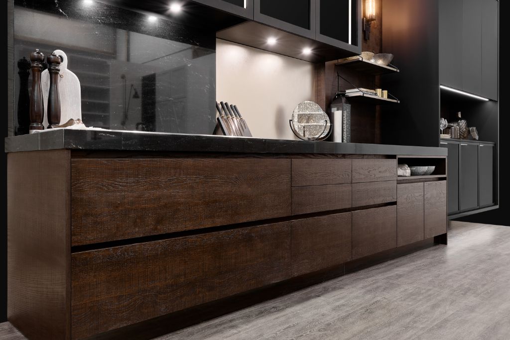 A modern Canadian Home style kitchen with dark wood cabinets and black counter tops.