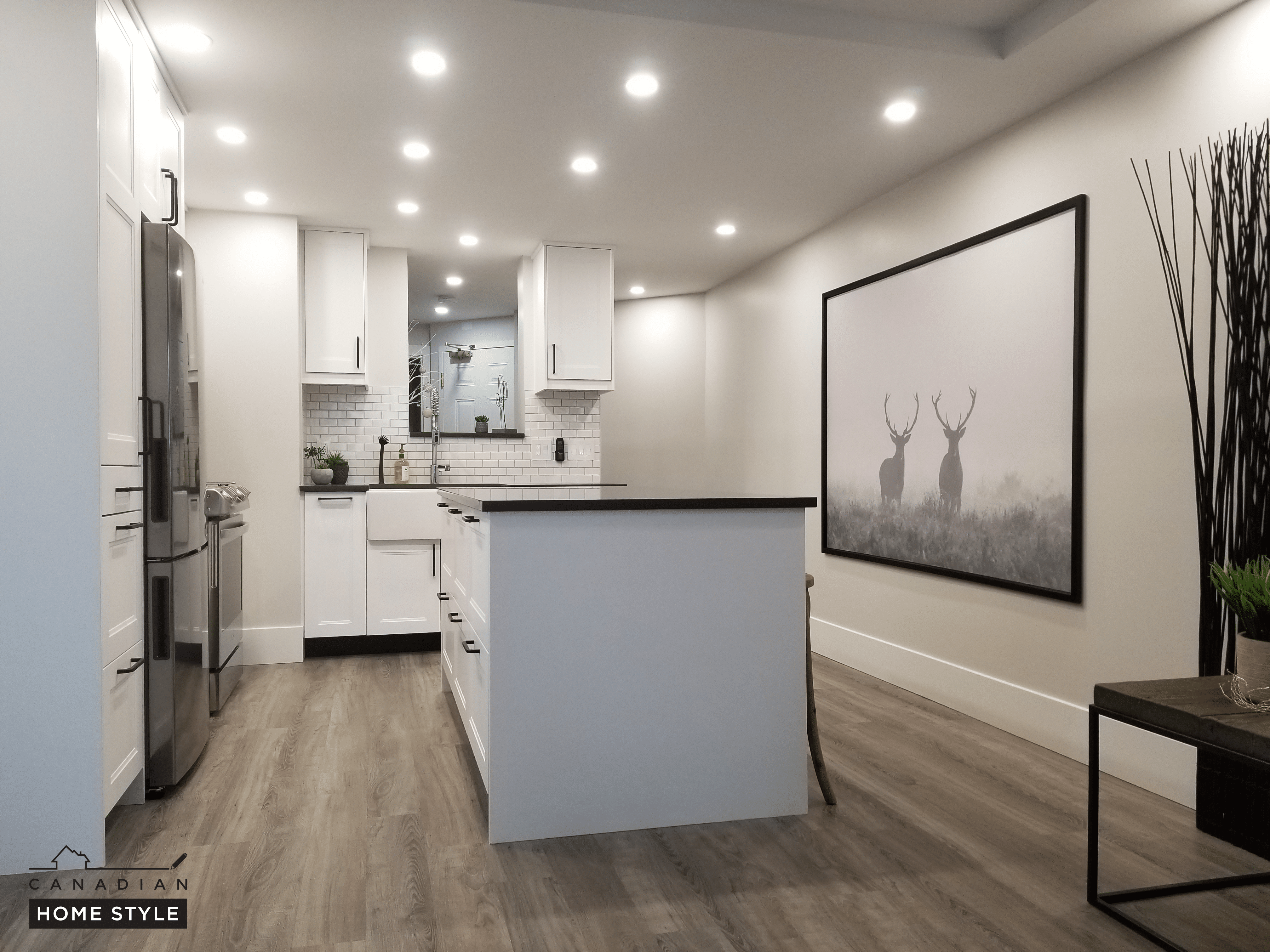 A rendering of a kitchen with white cabinets and wood flooring, featuring vinyl flooring.