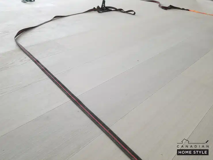 Engineered hardwood flooring being installed 