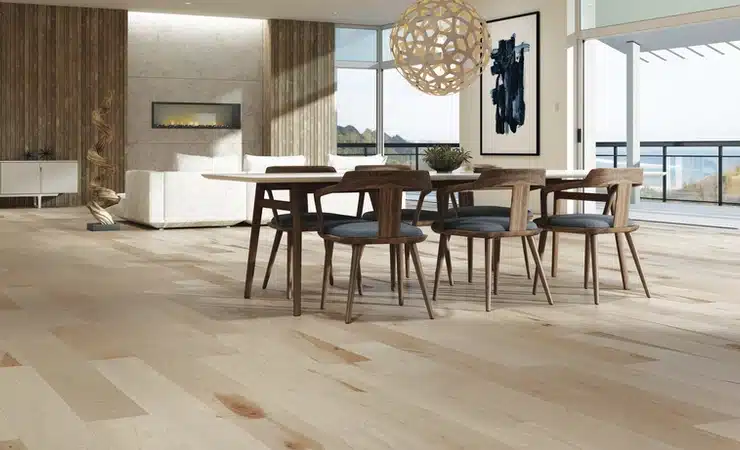 A living room with Mercier hardwood floors and a dining table.