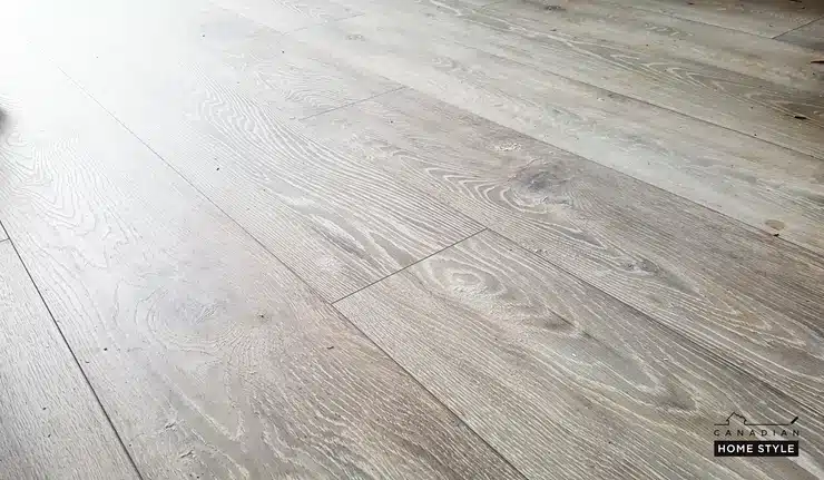 A close up of Torlys NatureTEK Waterproof Laminate Flooring in a room.