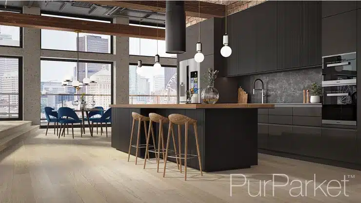 A modern kitchen with black cabinets and Purparket wooden floors.