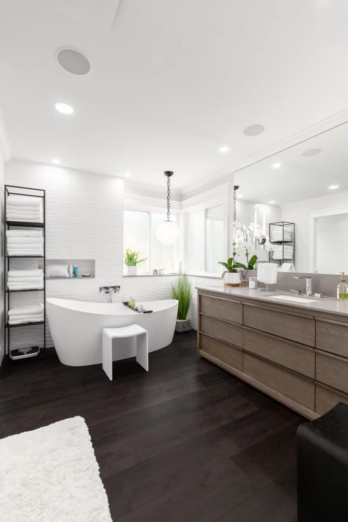 Bathroom Gallery: A modern bathroom with a large tub and sink.