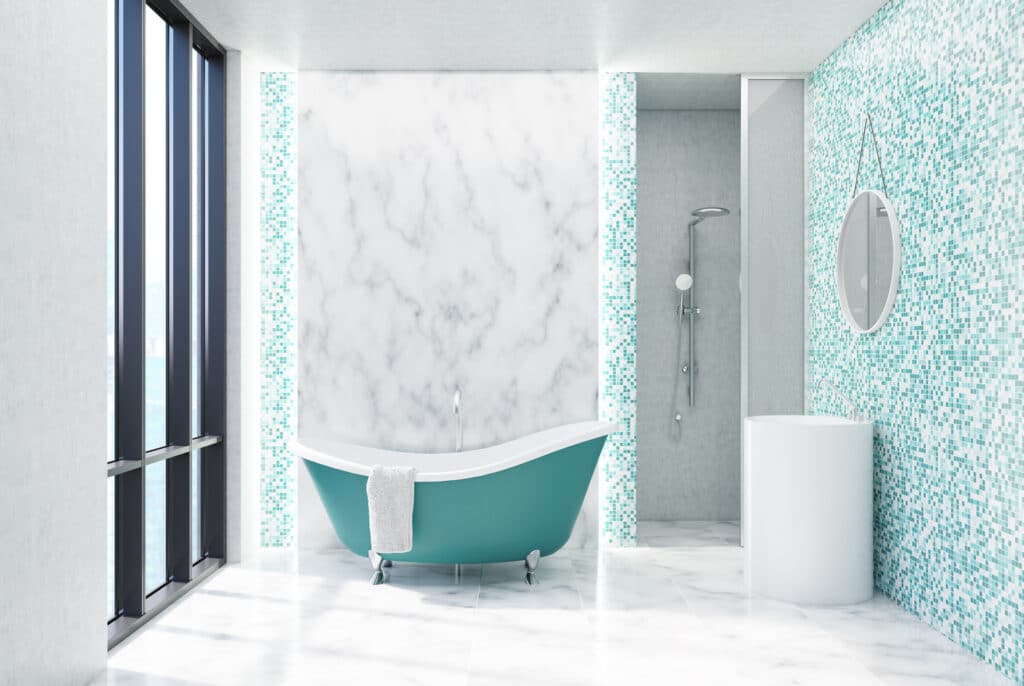 A bathroom with a blue and white tiled wall enhanced by the use of acrylic caulk.