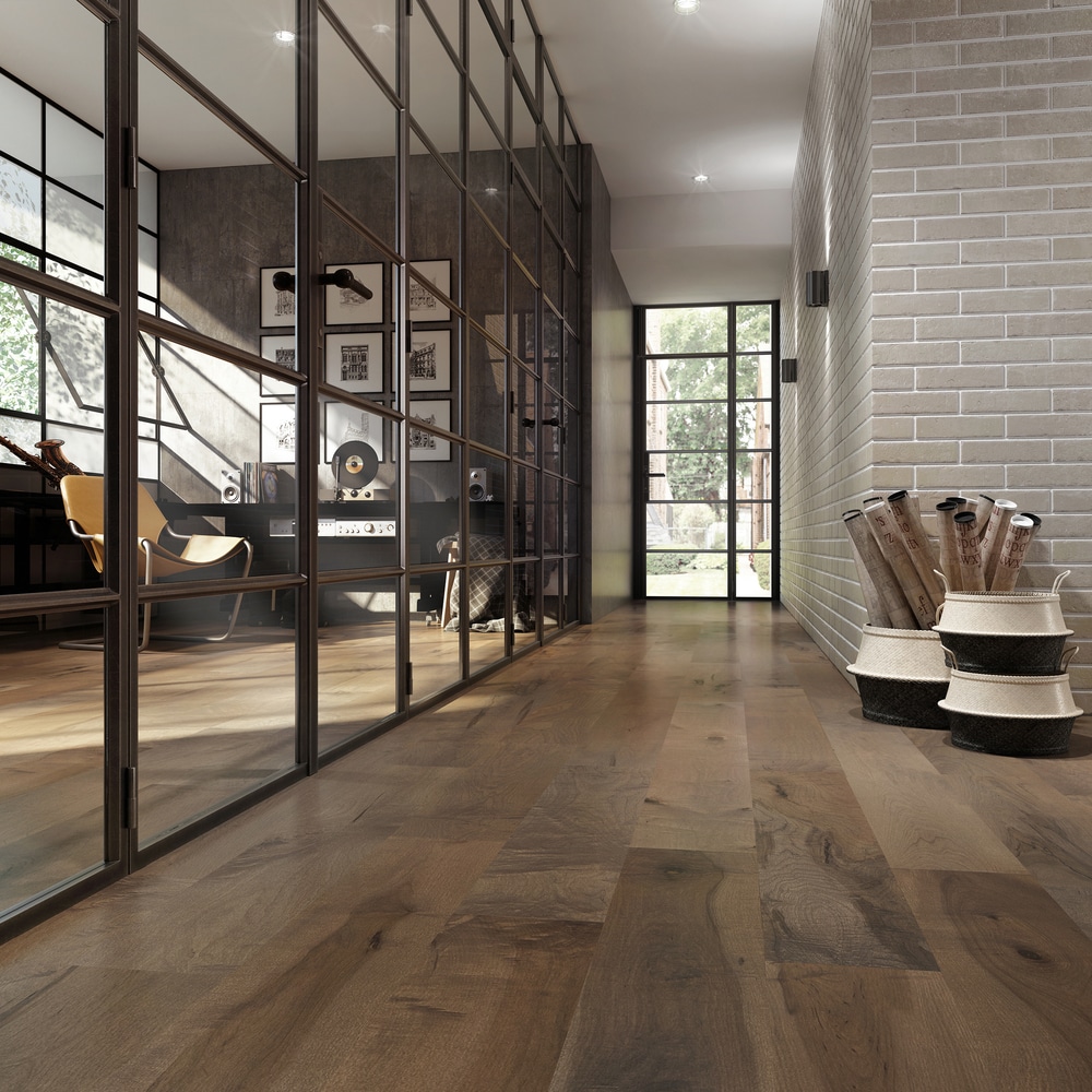 A Vancouver room with hardwood flooring and a glass wall.