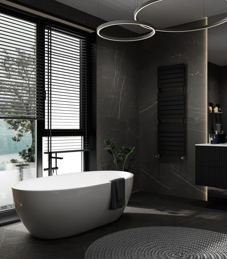 A black and white bathroom with a large tub.